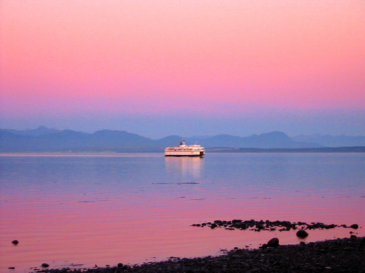 ferry arrives at sunset